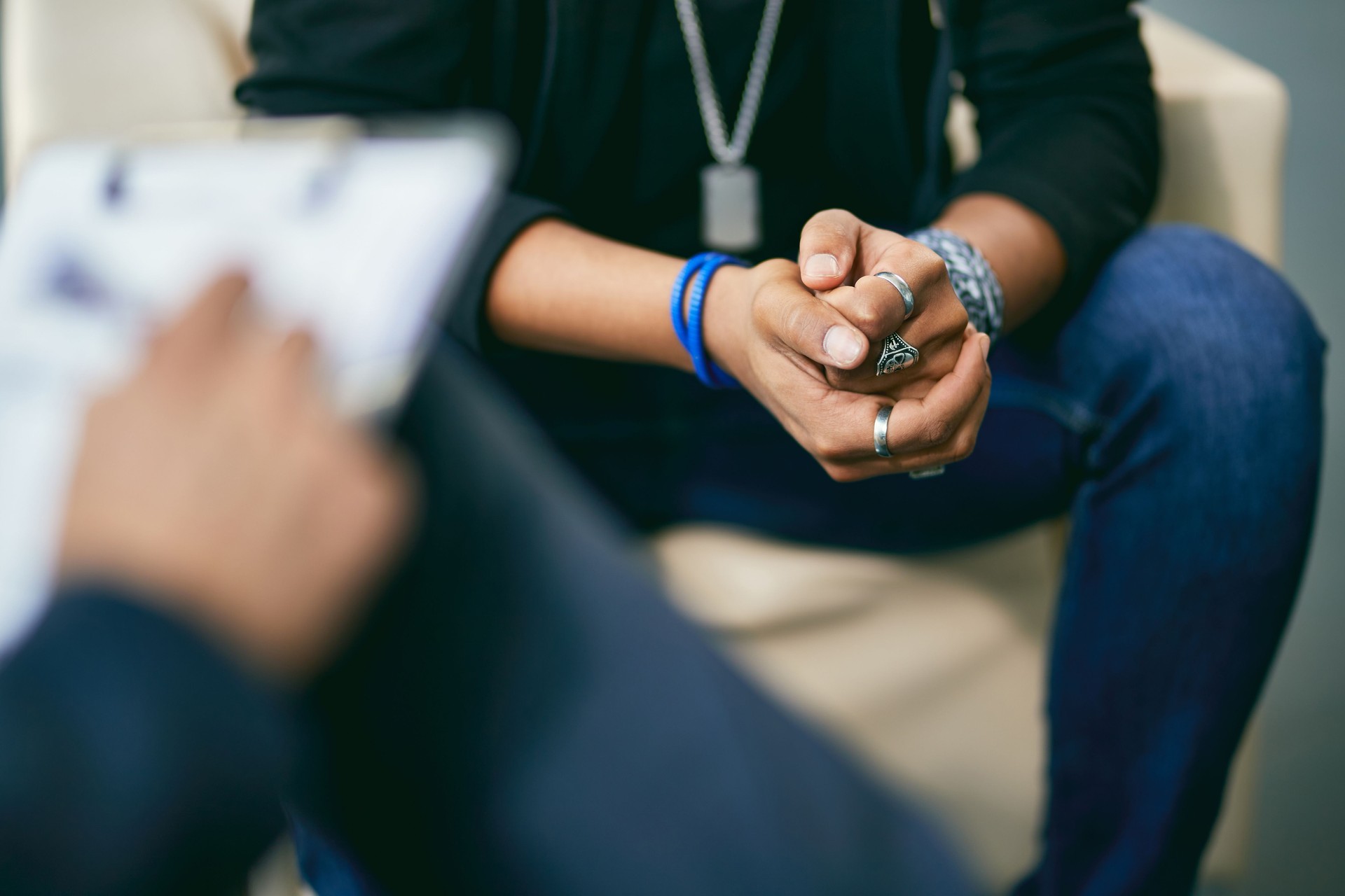 Close-up of black adolescent having a therapy session with psychologist. Close-up of black adolescent having a therapy session with psychologist.